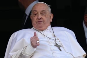Pope Francis appears in the hospital window, greeting the crowd after 5 weeks of treatment